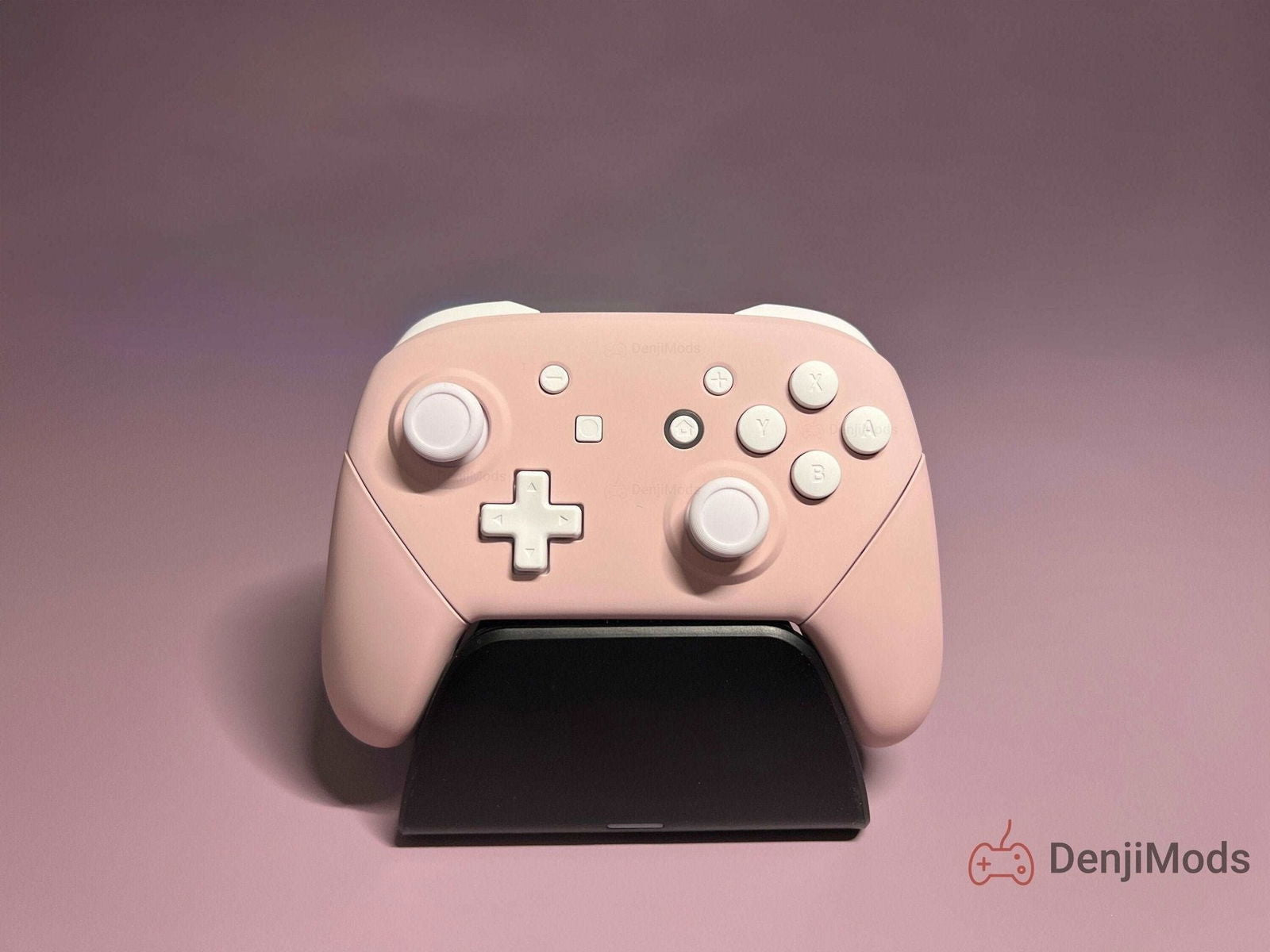 Custom Matte Pink Nintendo Switch Pro Controller on display stand.