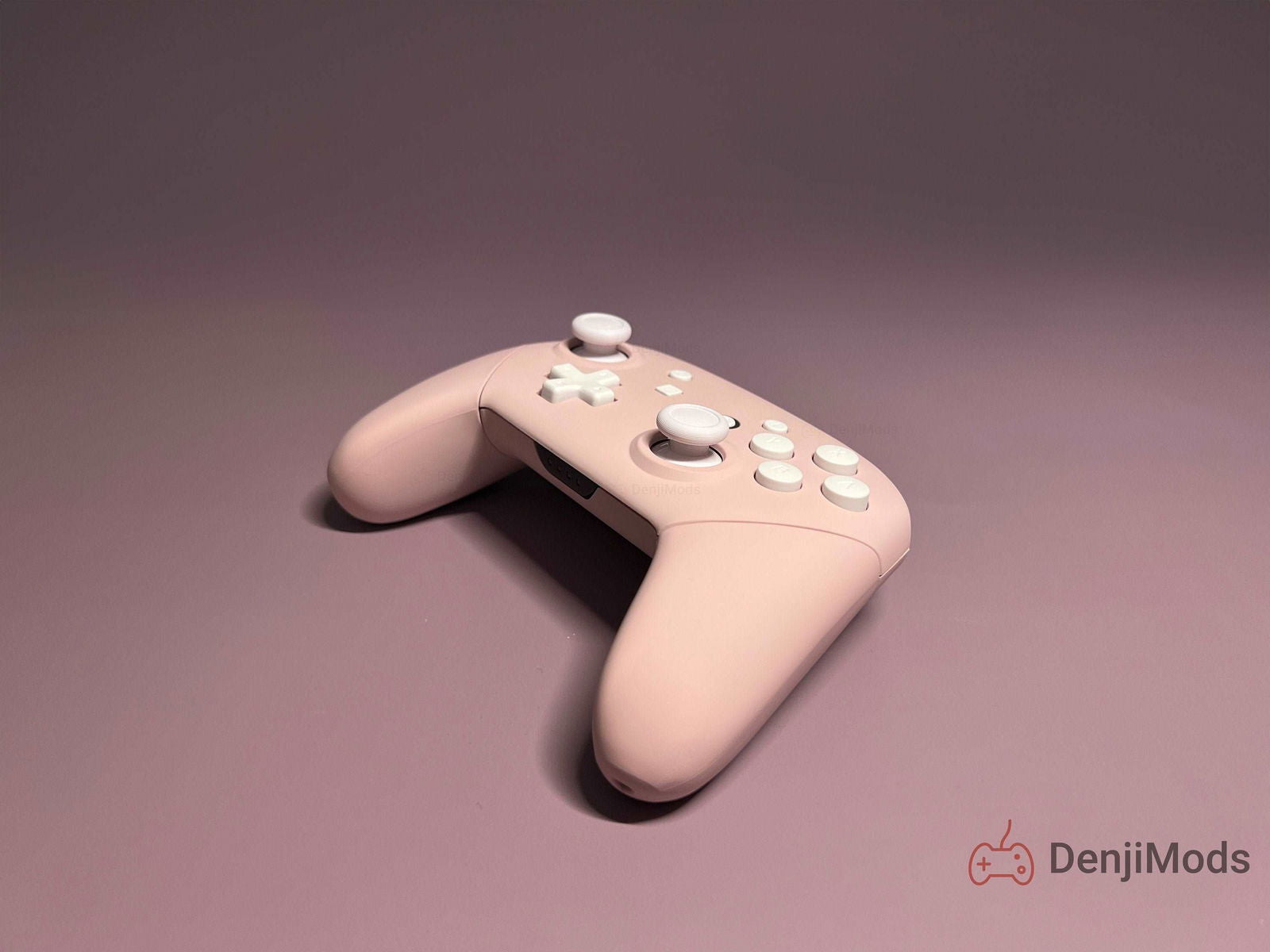 Custom matte pink Nintendo Switch Pro controller on display.