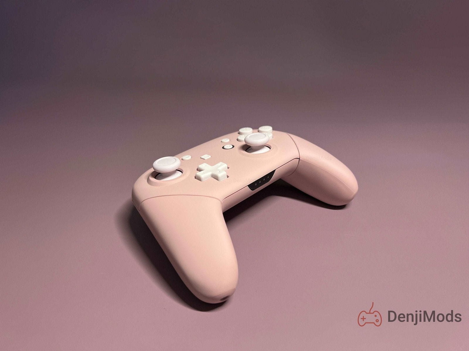 Matte pink custom Nintendo Switch Pro controller with soft touch finish.