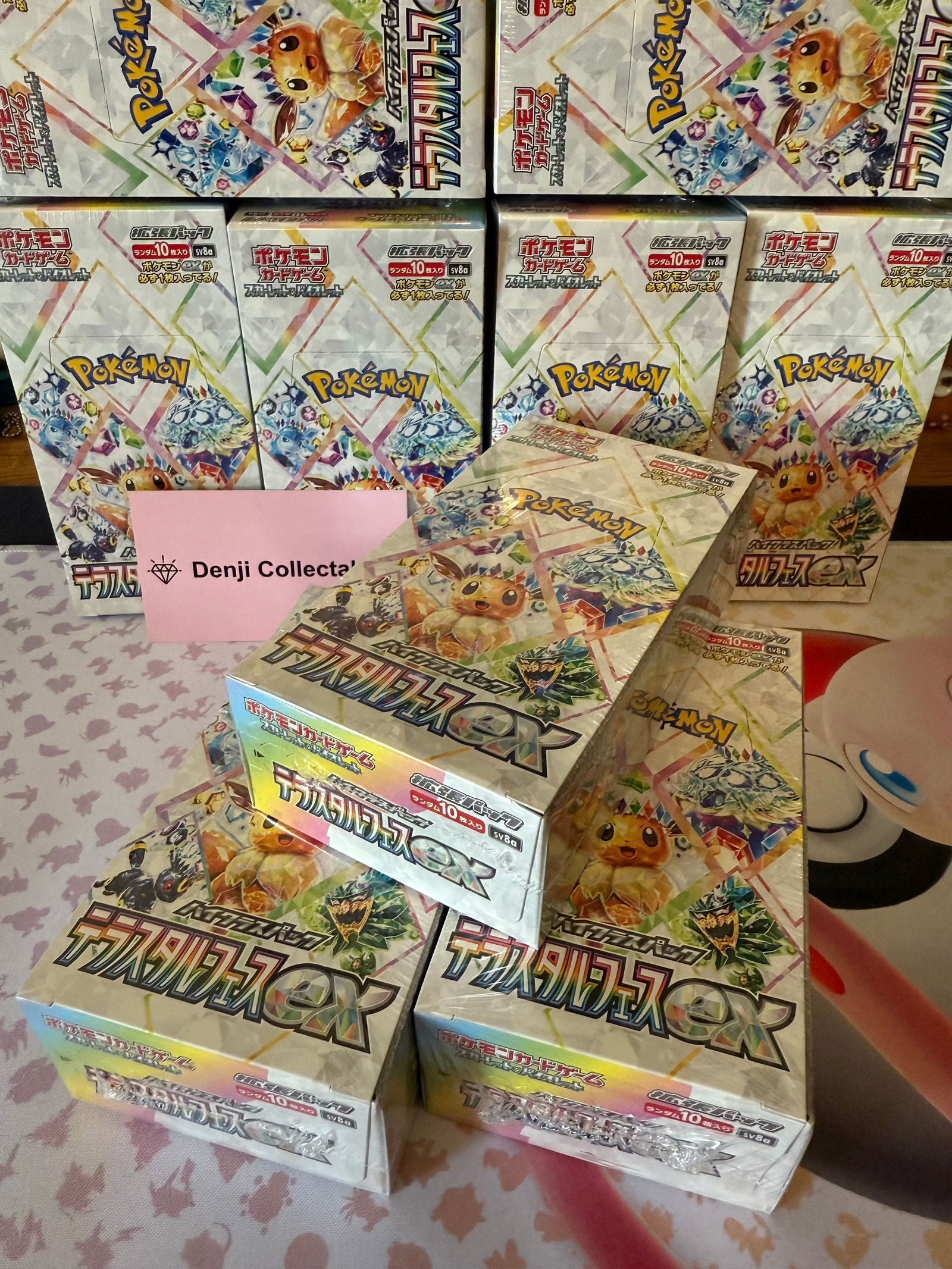 Pokémon Terastal Festival ex Booster Box preorder stack with vibrant packaging.
