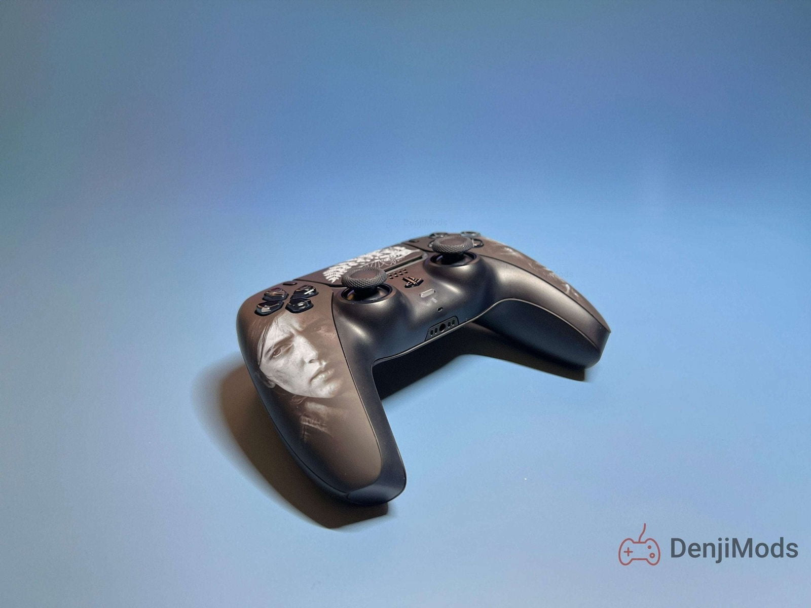 Custom The Last of Us PlayStation 5 DualSense Controller featuring Ellie and Joel design.